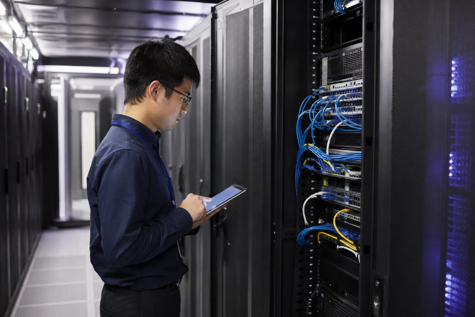 Illustrative technician checking network equipment